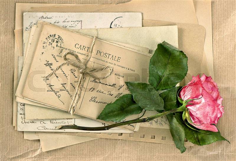 Old letters and rose flower. Vintage handwriting. Retro style toned picture, stock photo