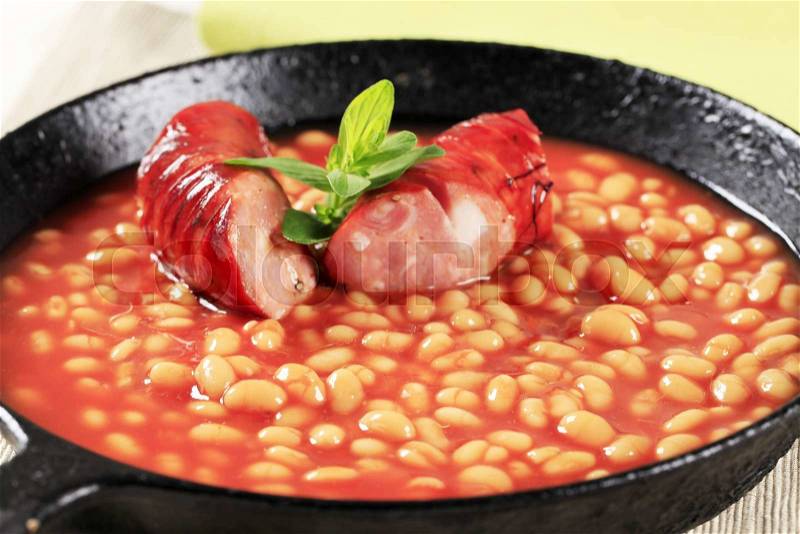 Baked beans and sausage in a fry pan, stock photo