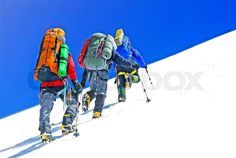 Group of climbers reaching the summit, Nepal Himalayas, stock photo