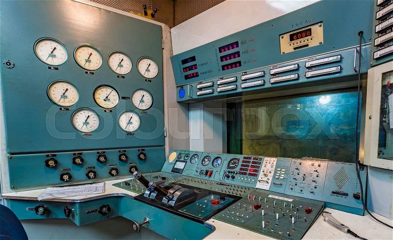 Working area in an aircraft factory. Operating panel with instrumentation and control levers, stock photo