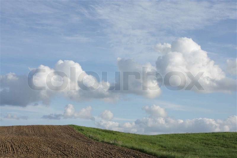 Summer sky with nice cloud formation and danish country side landscape, stock photo