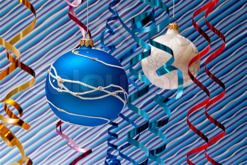 Christmas decoration from two blue and white balls. Blue background, stock photo