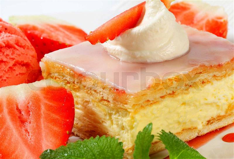Custard (Vanilla) Slice with fresh strawberries and ice cream, stock photo