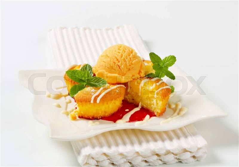 Custard filled muffins with scoop of ice cream, stock photo