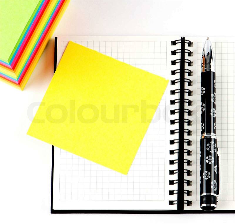Pencil on open note book. Colorful paper notes, stock photo