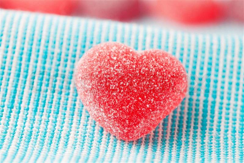 Heart shape candy for Valentine\'s day on a light blue background, stock photo