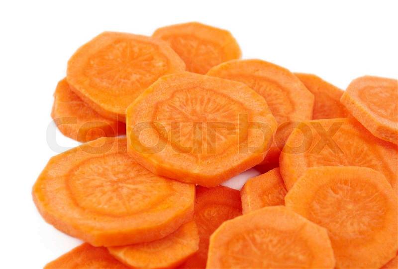 Carrots cut into circles on a white background, stock photo