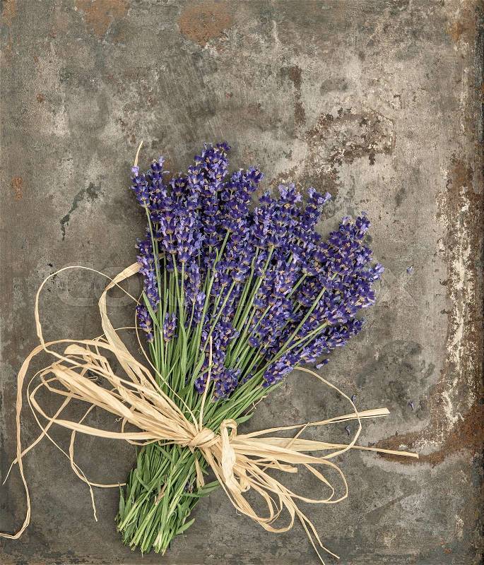 Lavender flowers with shabby chic style decorations. Fresh blossoms over rustic metal background, stock photo