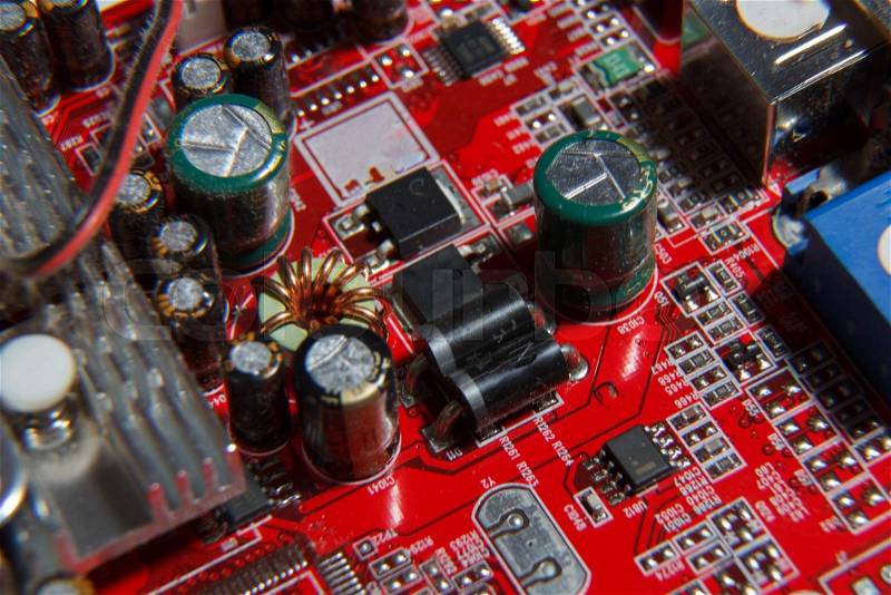Close-up photo of a red computer component, stock photo
