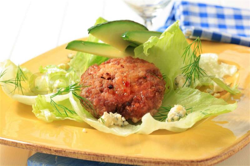 Meat patty with lettuce, avocado and blue cheese, stock photo