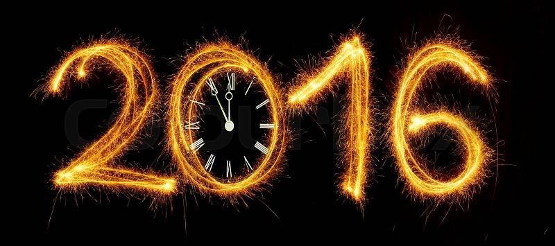 Happy New Year - 2016 with clock face made with sparklers on black background, stock photo