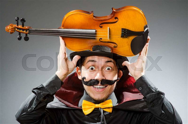 Funny violin player wearing tophat, stock photo
