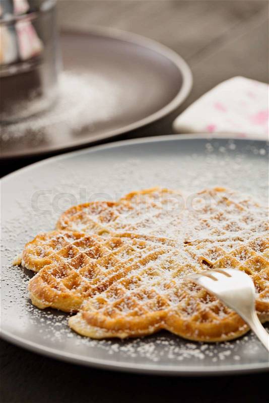 Hot waffle with powdered sugar, stock photo