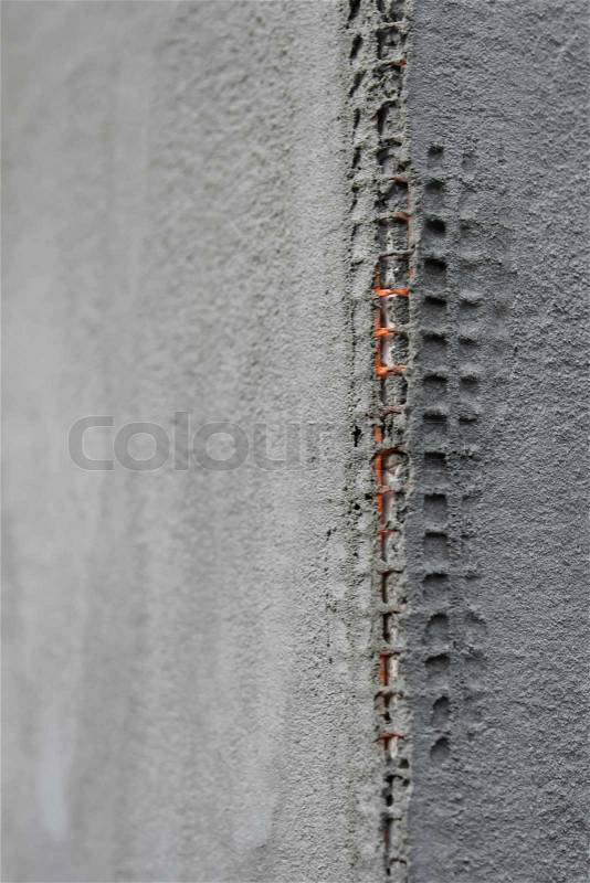 The walls are covered with mesh and construction adhesives mixture, stock photo