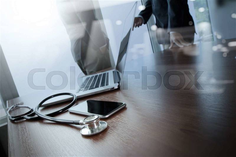 Double exposure of team doctor working with laptop computer in medical workspace office as concept, stock photo