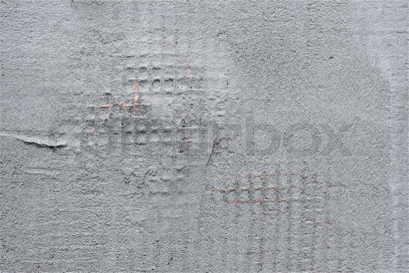 Detail of a wall covered with plastic mesh and construction glue, stock photo