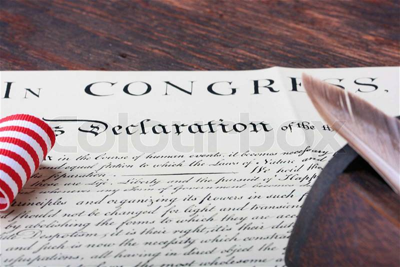 The ancient text of the declaration on independence of the United States of America with a casket and a feather for the write, stock photo