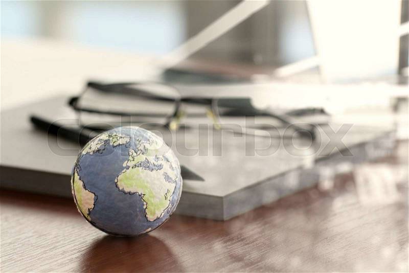 Double exposure of hand drawn texture globe on wood table near note book and glasses, stock photo