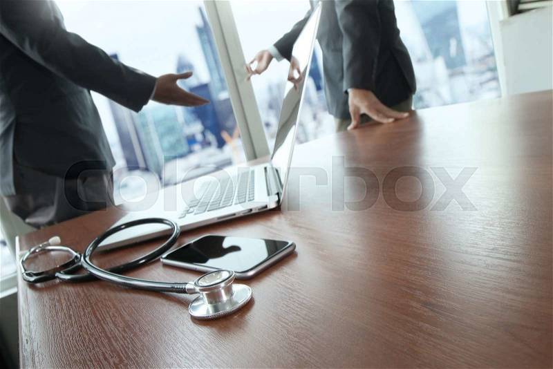 Team doctor working with laptop computer in medical workspace office and medical network media diagram as concept , stock photo
