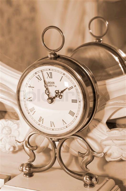 Vintage clock. Sepia, stock photo