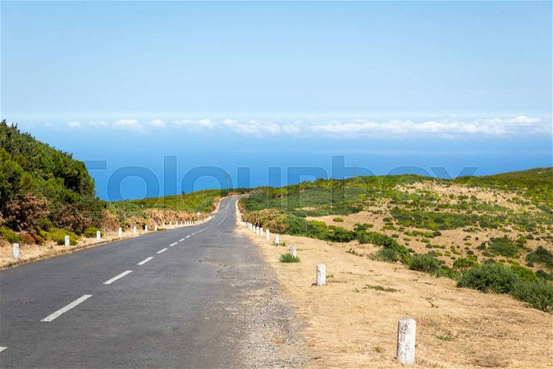 Road in green summer mountains, Portugal, Madeira, stock photo