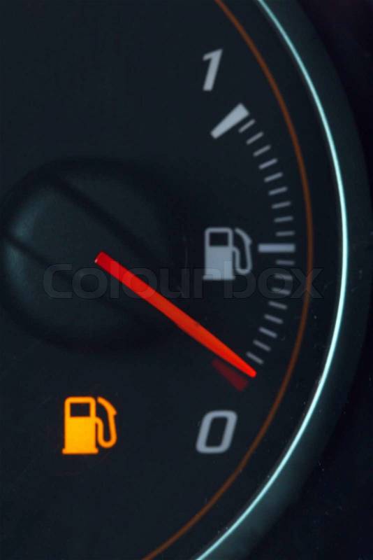 Cash gauge on the dashboard approaching empty value, stock photo