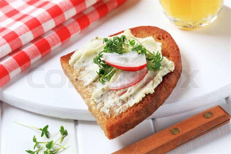 Pan fried bread with cheese spread and cress, stock photo