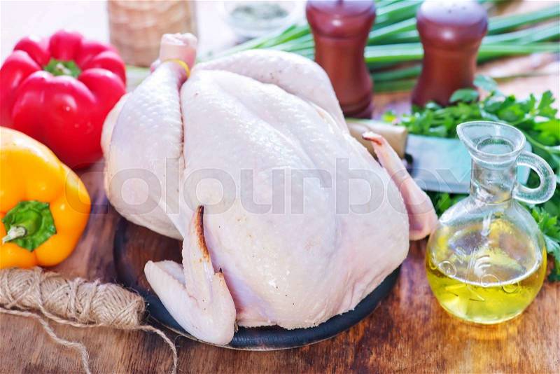 Raw chicken with spice and raw vegetables, stock photo