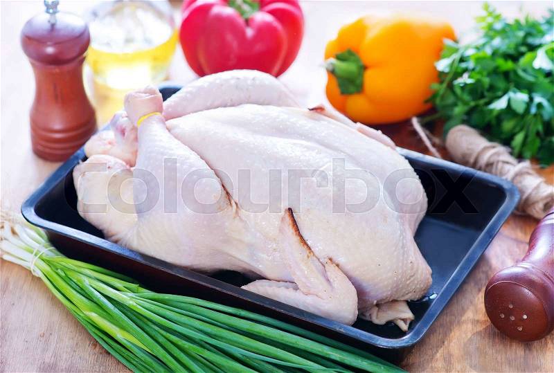 Raw chicken with spice and raw vegetables, stock photo