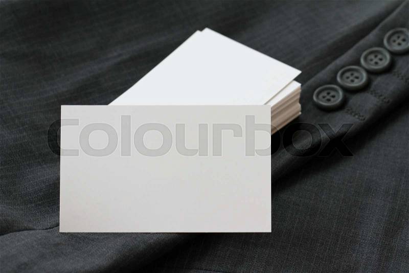 Blank corporate identity package business card with dark grey suit background, stock photo