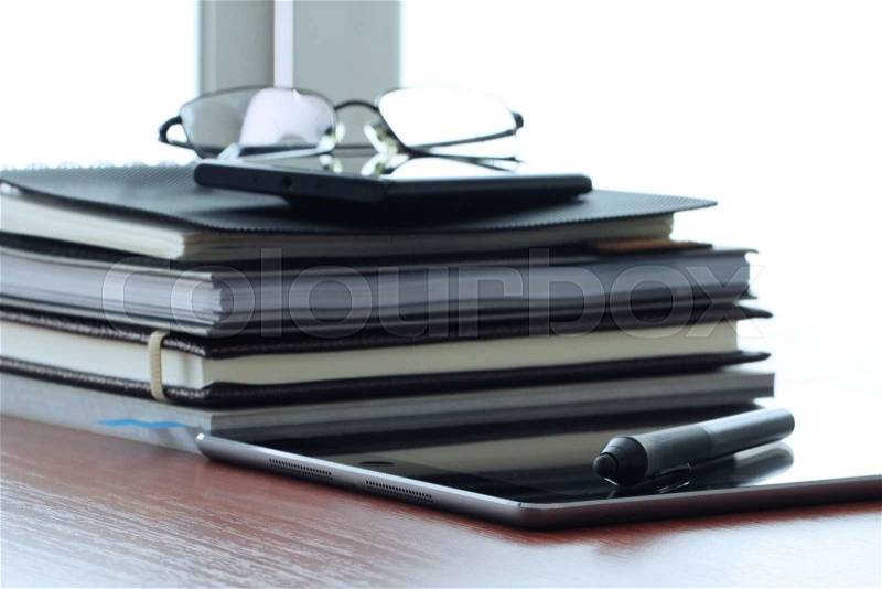 Close up of tablet and stylus with office workstation , stock photo