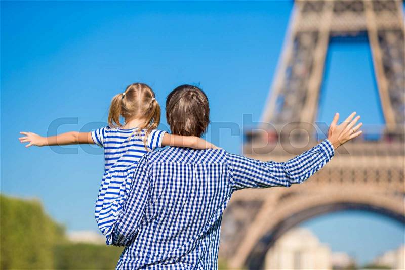 French summer holidays, travel and people concept - happy family in Paris background Eiffel Tower, stock photo