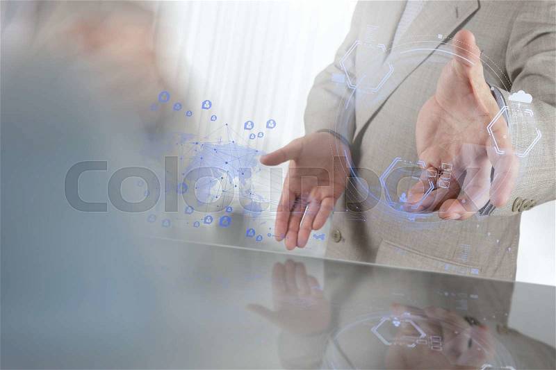 Businessman shows modern technology as concept, stock photo