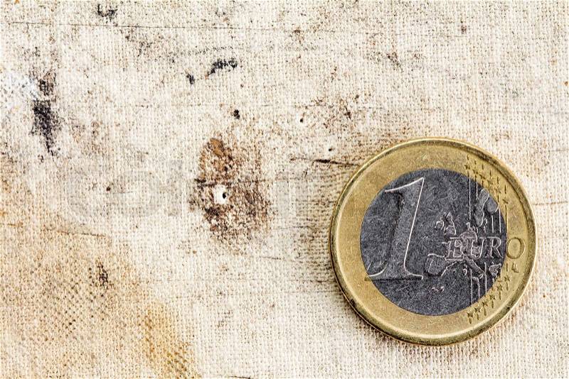 One Euro on old canvas background with copy - space, stock photo