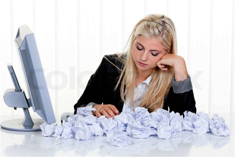 Young woman with paper seeks idea. Frustrated by lack of ideas, stock photo