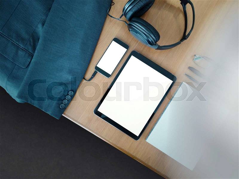 Business office desk and office supplies with blank modern digital tablet and smart phone as concept, stock photo