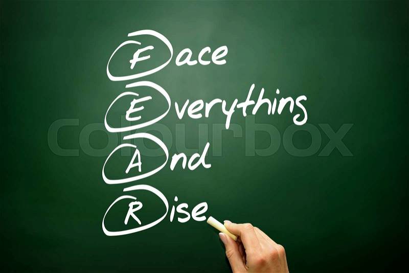 Hand drawn Face Everything And Rise (FEAR) acronym, business concept on blackboard, stock photo