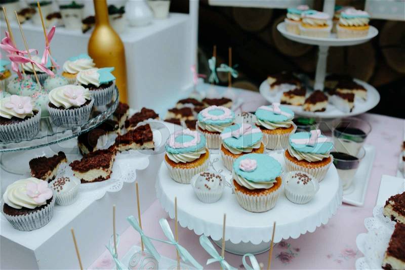 Delicious fancy wedding cake made of cupcakes, stock photo
