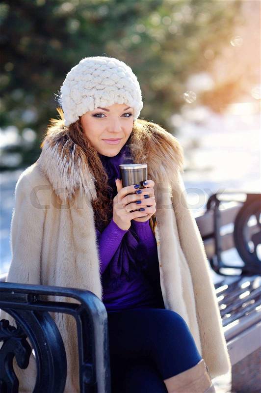 Beautiful Happy Smiling Winter Woman with Mug Outdoor. Laughing Girl Outdoors with Hot Drink, stock photo