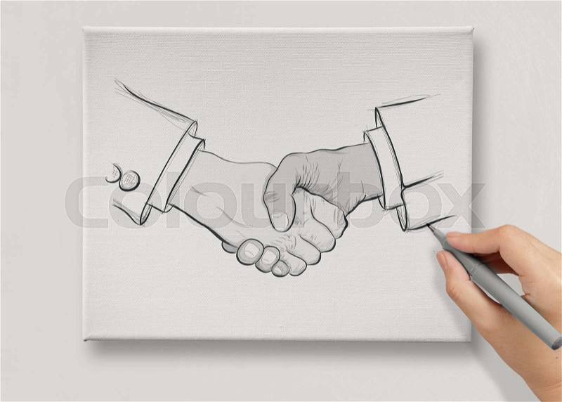 Hand drawn handshake sign on canvas board as partnership business concept, stock photo