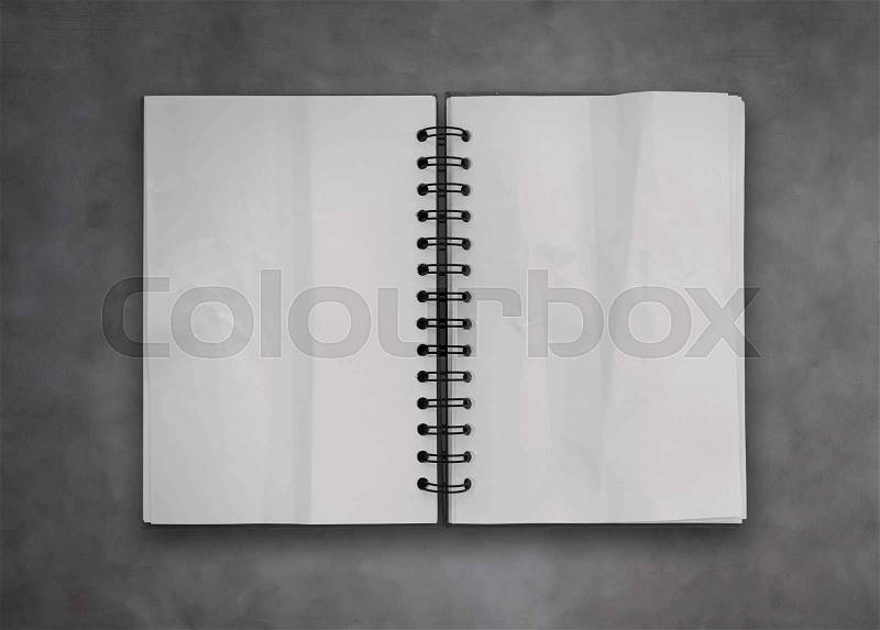 Sticky notes with open blank note book on deak top texture, stock photo