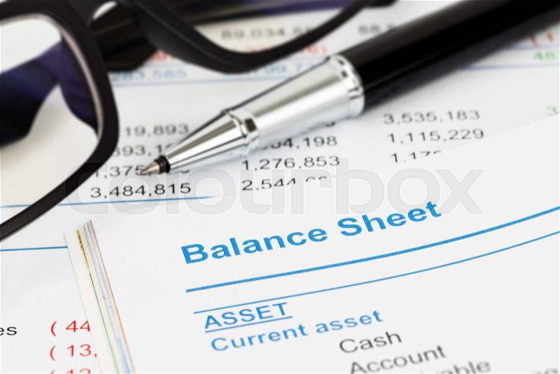 Balance sheet in stockholder report book, balance sheet is mock-up, stock photo