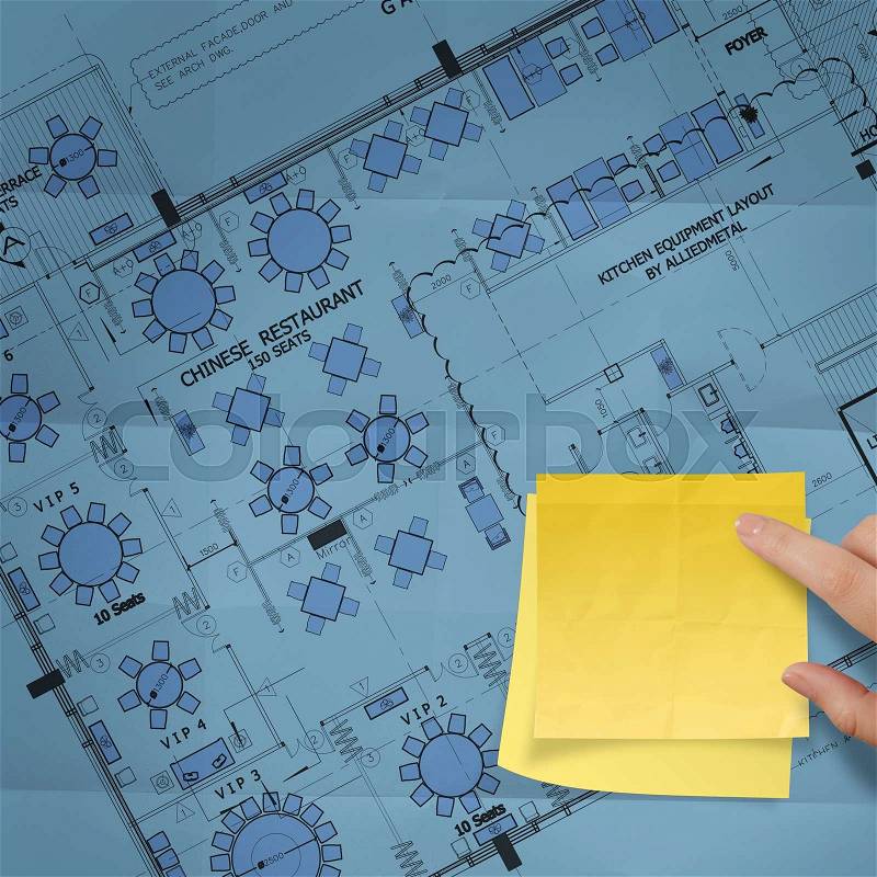 Blank sticky note on construction site with layout plan crumpled paper , stock photo