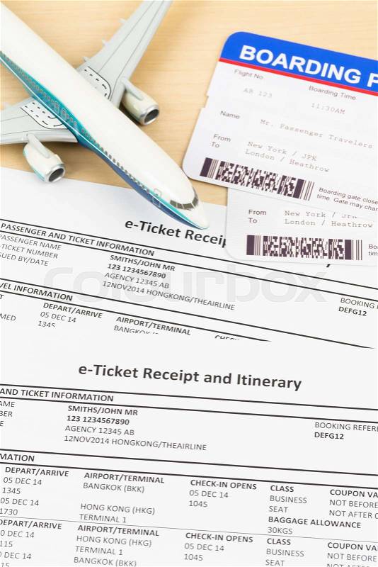 E-ticket with plane model, and boarding pass, stock photo