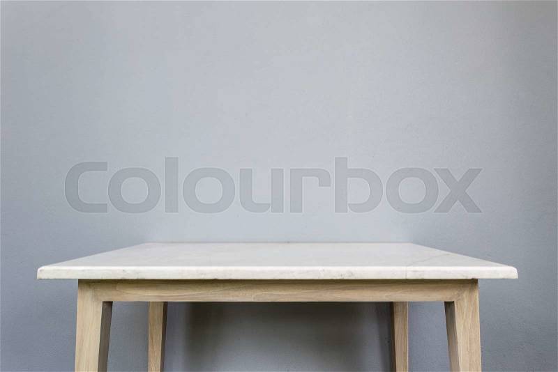 Empty top of white mable stone table on grey wall background. For product display, stock photo