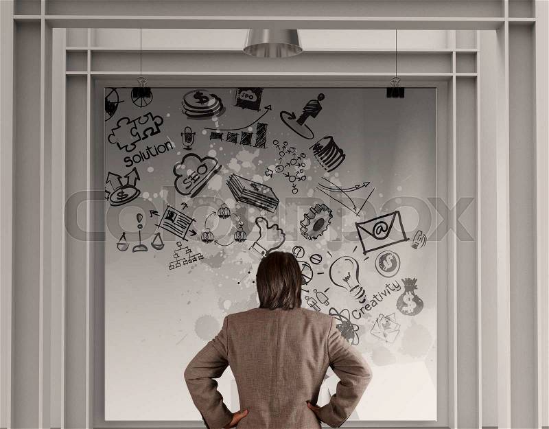 Businessman looking business concept on poster with composition wall, stock photo