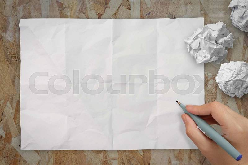 Hand drawing on blank wrinkled paper as concept, stock photo