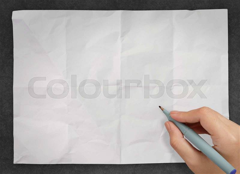 Hand drawing on blank wrinkled paper as concept, stock photo