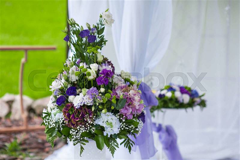 Wedding arrangement of purple flowers, stock photo