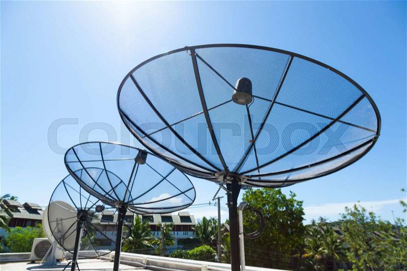 Satellite dishes Mounted on the rooftop of the building. Satellite TV Receiver, stock photo